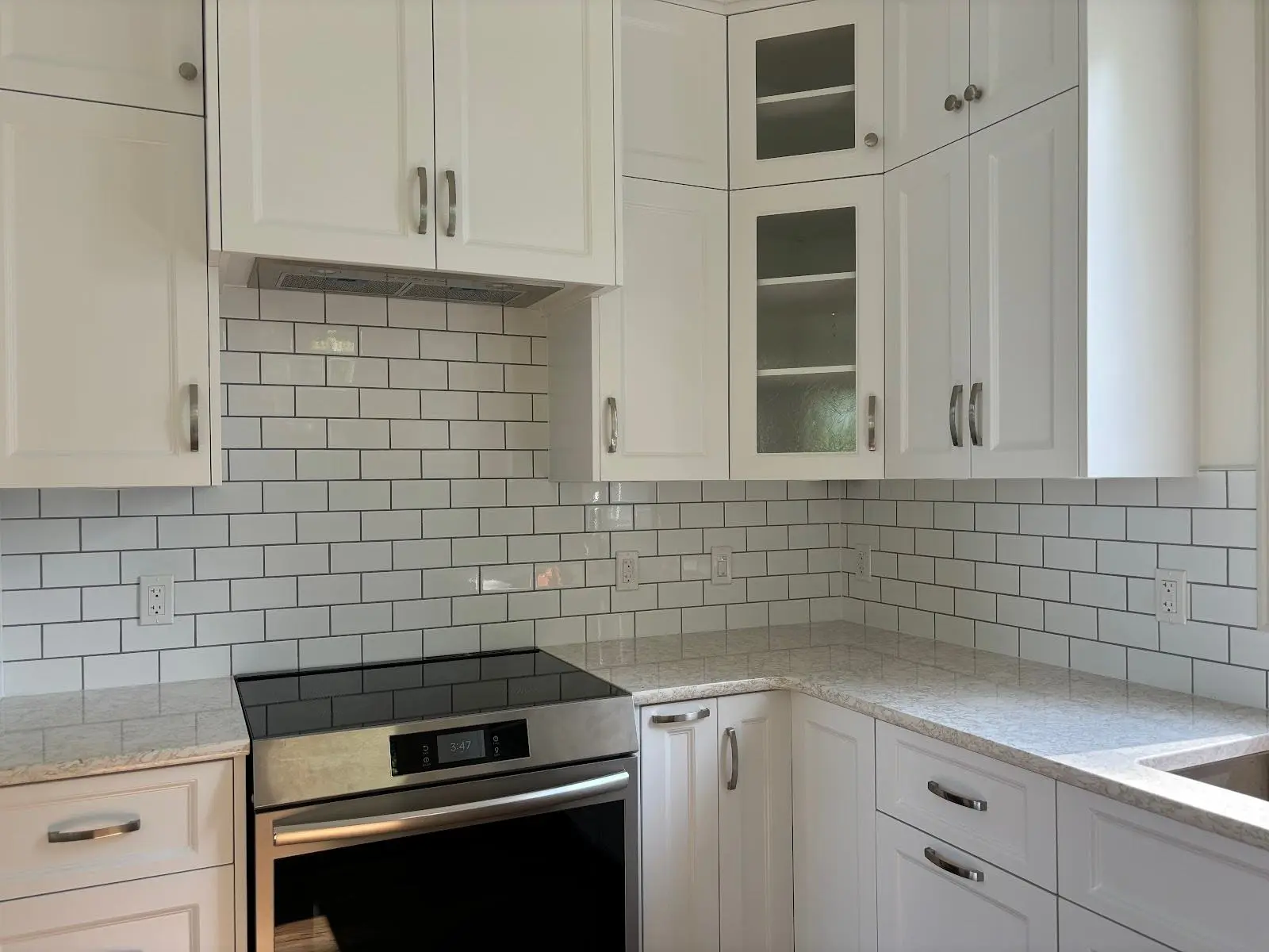 white kitchen with accent subway tile
